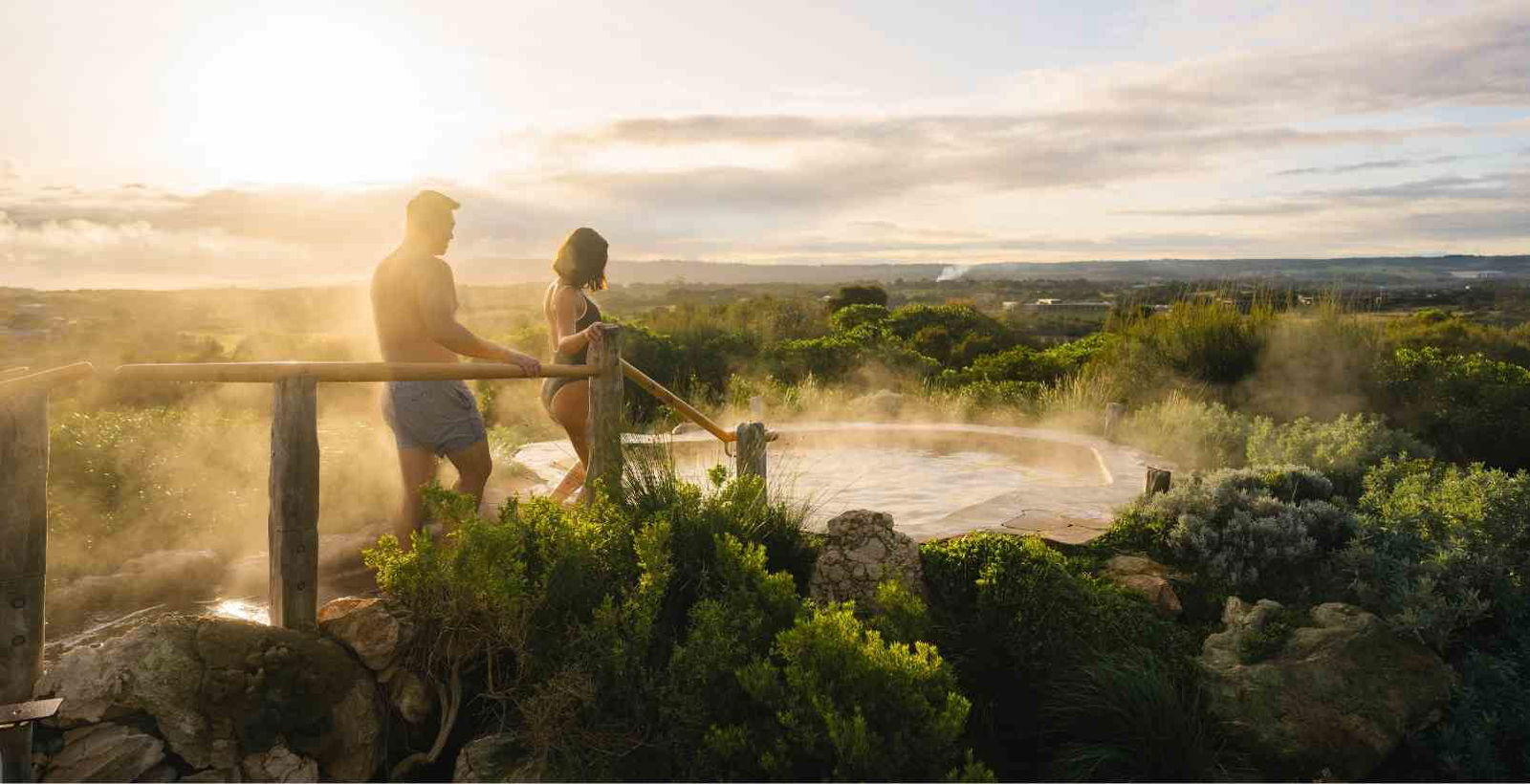 man and woman walking into hot springs pool at the mornington peninsula hot springs