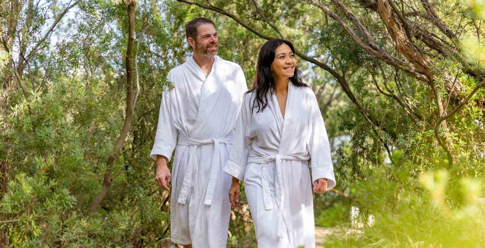 Couple walking through mornington peninsula hot springs